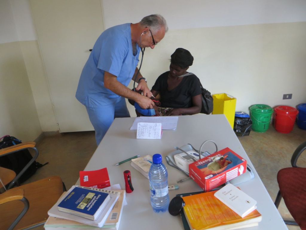 Dr Gabriele helping one of the many patients at CCH
