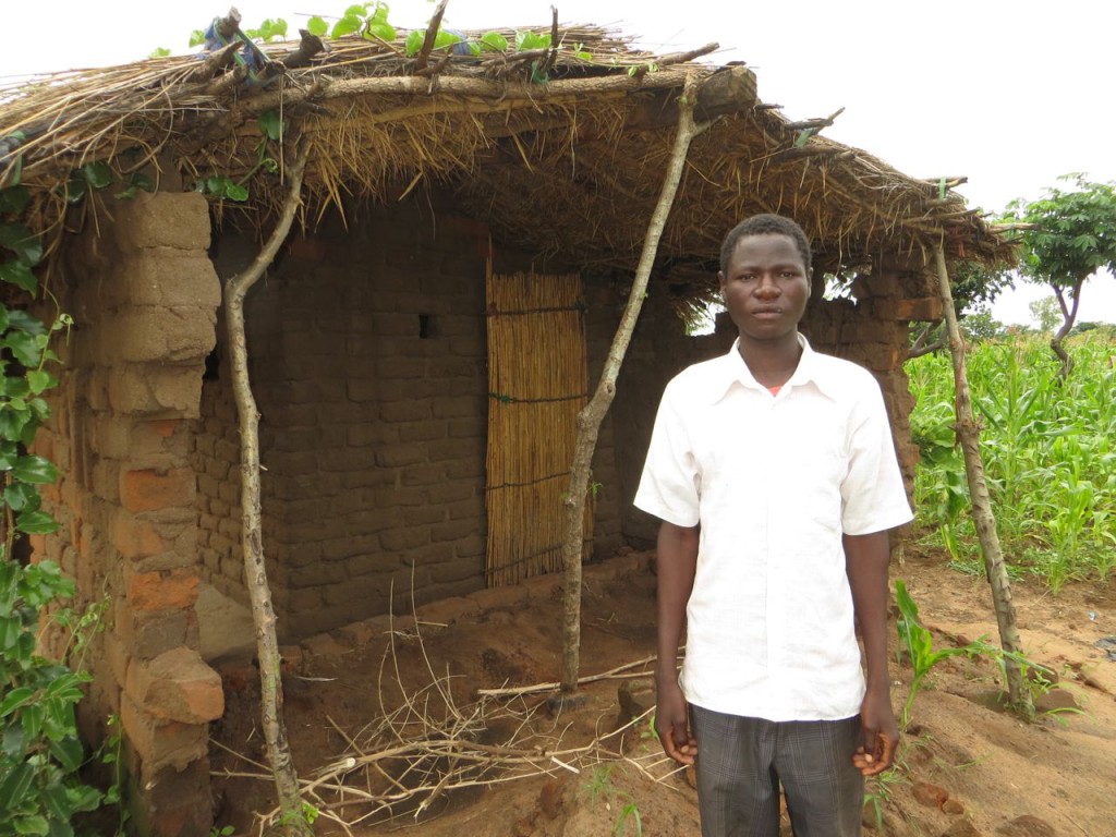 Kasimu on his fallen hut